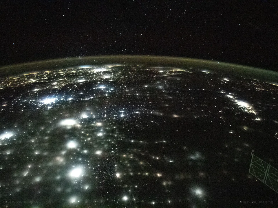 City lights spread across North America at night, photographed from orbit