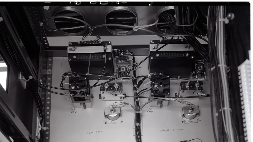 Close view of relays, voltage modules and cable looms in a control rack