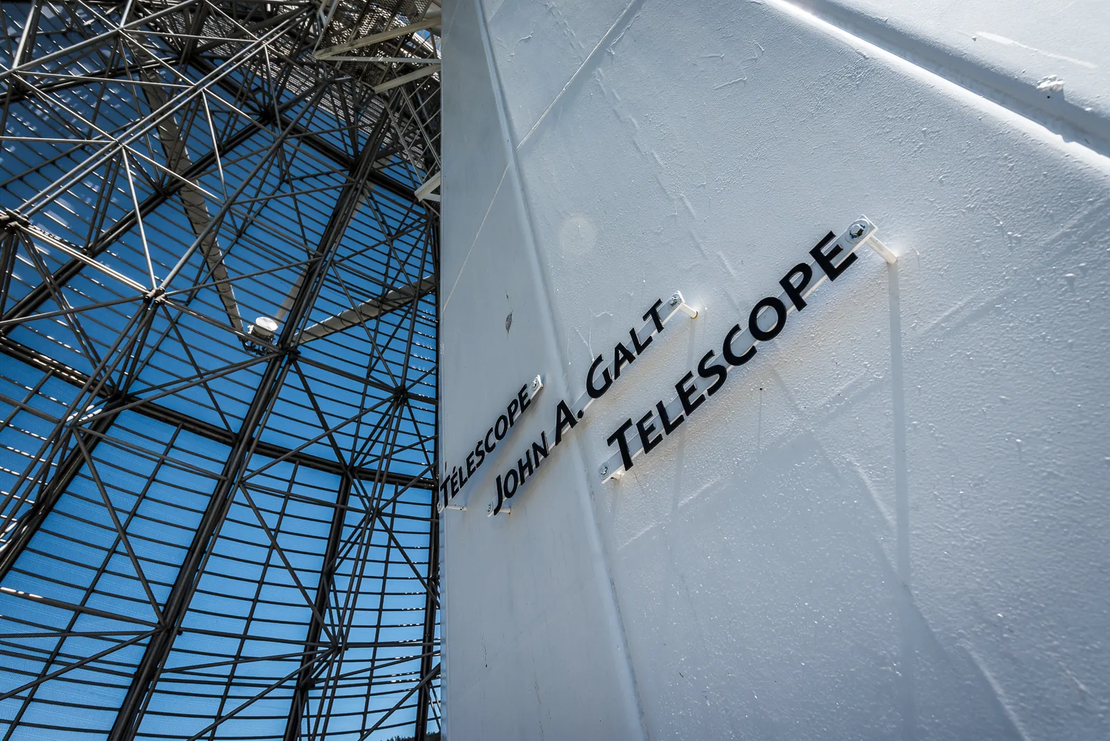 Steel truss of the John A. Galt Telescope at the Dominion Radio Astrophysical Observatory against a blue sky