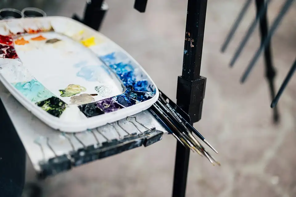 Photo: Art tools and paint palette set up for a creative session