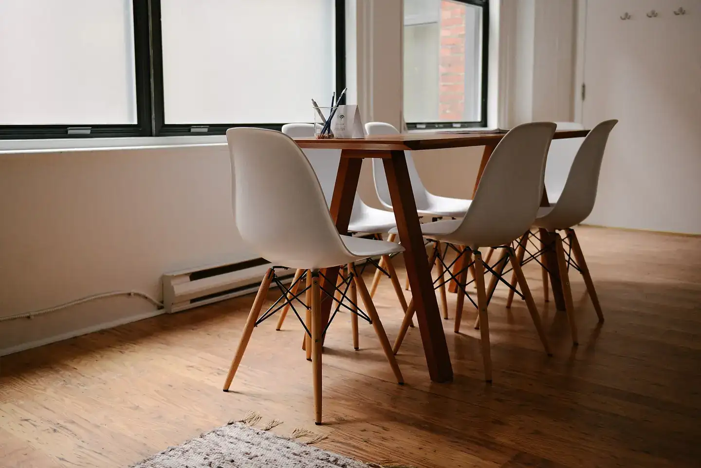 A dining table and chairs in a bright apartment in Montreal