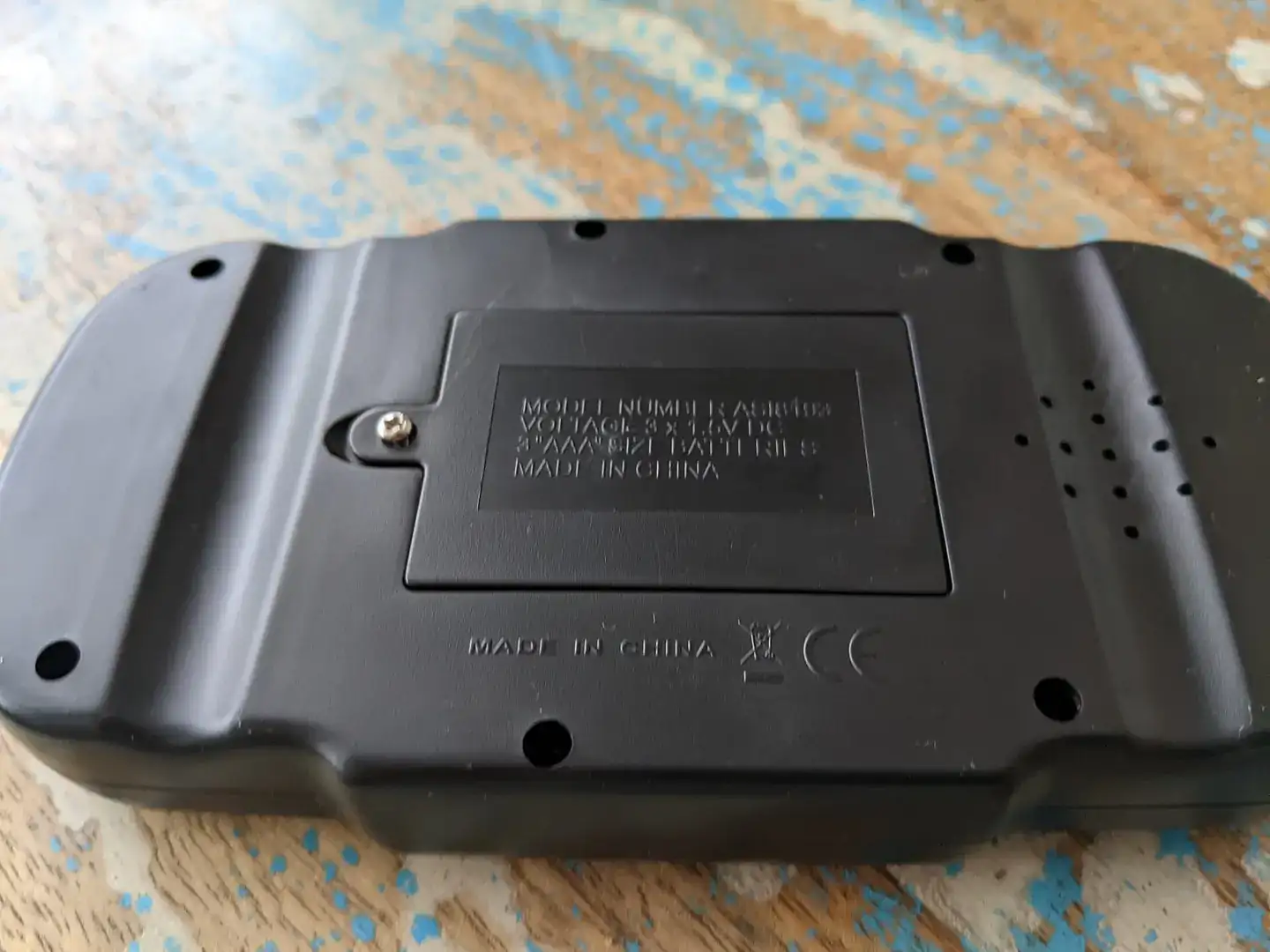 The back cover of a small handheld electronic sudoku game, with the model number ASI8193