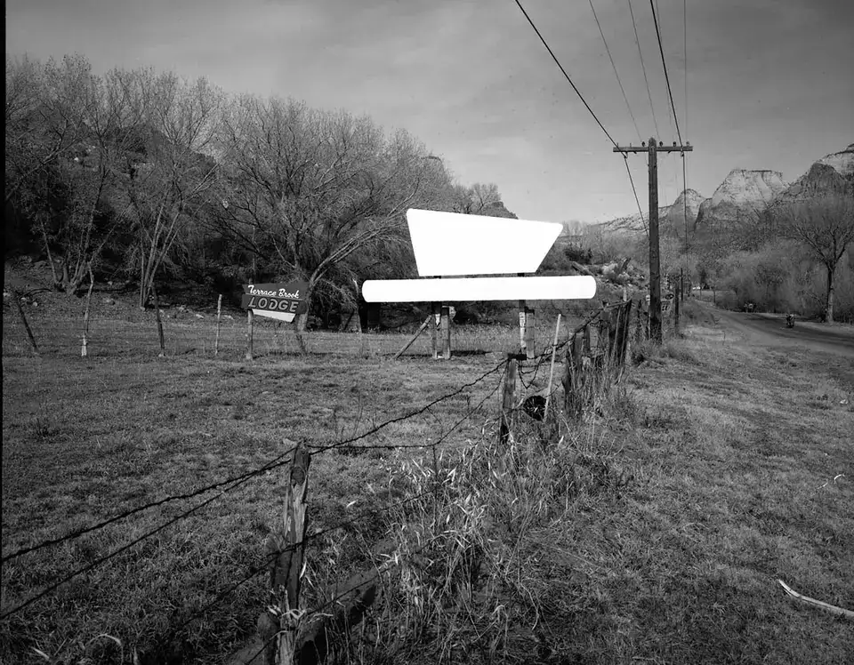 Roadside signs in Springdale, Terrace Brook Lodge sign and blank billboard
