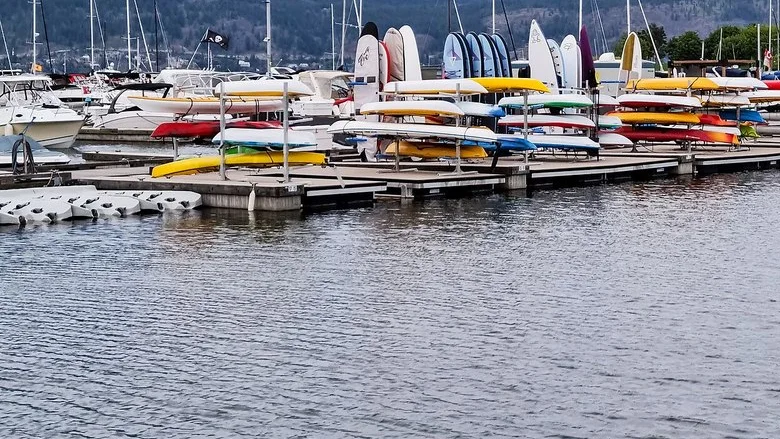 Boats moored at the Kelowna Downtown Marina on Okanagan Lake